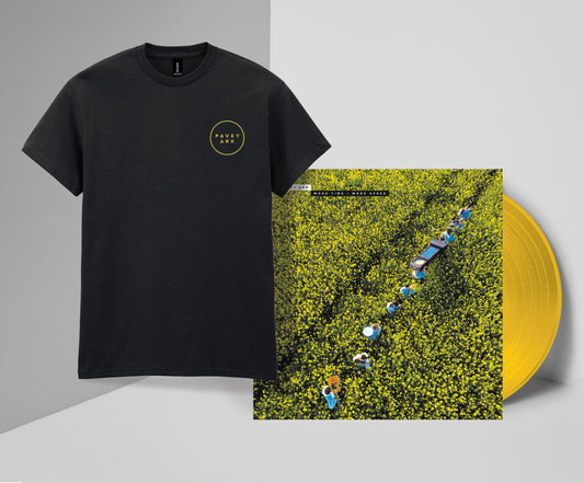 Black t-shirt with a small logo and a vinyl record with a yellow label on a gray background